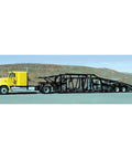Yellow truck hauling car hauler trailer outdoors, suitable for Electric Hydraulic Totally Enclosed Pump Motor For Auto Transport And Car Hauler
