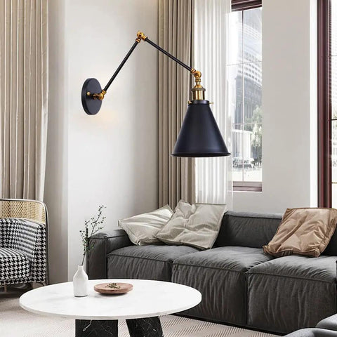 Heavy Duty Metal Swing Arm Wall Sconce With Slick Black Finish And Smooth Swivel Joint For Cozy Bedroom Reading And Chill Hallway Ambiance That Drops Major Style Points On Any Wall in a modern living room setting.