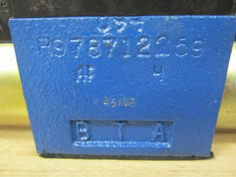 Close-up of blue part on single hydraulic directional valve 081WV06P1V1004KE024/00E51 PN 9810231478 with engraved details.