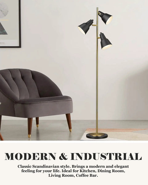 Dope Gold Tree Floor Lamp With Three Adjustable Rotating Lights standing beside a gray chair in a modern living room setting