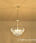 5 Light Beaded Chandelier With Rustic White Wood Beads Farmhouse Boho Ceiling Light Fixture, illuminated in foyer setting.
