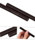 2 Pack Wood Filler Sticks for Furniture Repair Scratch Remover Pens Quick Fix Paint Markers, close-up of black sticks in hand