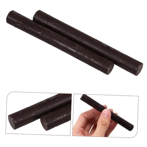 2 Pack Wood Filler Sticks for Furniture Repair Scratch Remover Pens Quick Fix Paint Markers, close-up of black sticks in hand