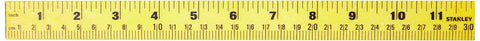 Stanley 12-inch yellow ruler with imperial inches and metric centimeters.