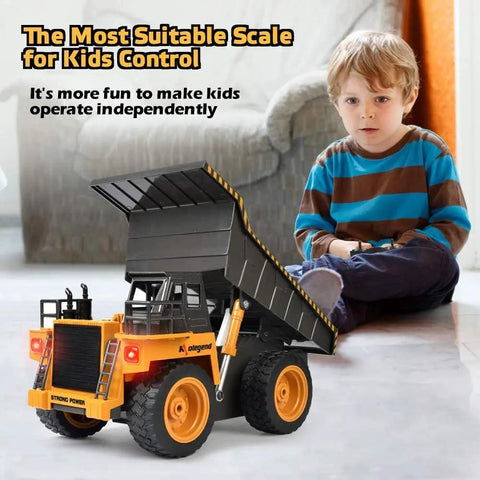 Young boy playing with Remote Control Dump Truck For Kids And Toddlers, Realistic RC Construction Vehicle, indoors