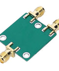 Smooth Operator RF Two Way Power Splitter Module DC To 5GHZ Range With SMA Adapters green PCB design with SMA connectors for signal division.