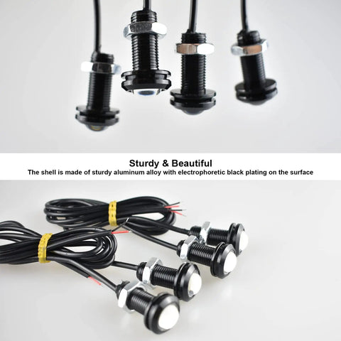 Universal Amber LED Front Grille Marker Lights with Projector Lens, aluminum housing, and copper wire conductors displayed on a white surface.