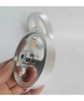 KVXJH Aluminum Alloy Synchronous Encoder Wheel Measuring Wheel, 40mm diameter, detailed handheld view showcasing craftsmanship.
