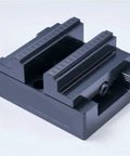 Top Shelf H90 Style Precision CNC Bench Vise With Self Centering Grips And Flexible Four Five Axis Rotation For Smoother Milling Operations. Close-up of solid metal jaws.