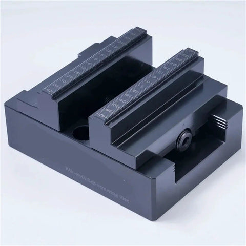 Top Shelf H90 Style Precision CNC Bench Vise With Self Centering Grips And Flexible Four Five Axis Rotation For Smoother Milling Operations. Close-up of solid metal jaws.