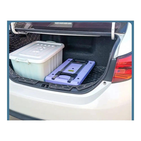 Foldable Flat Bed Cart With Wheels For Home And Courier Use, Heavy Duty Hand Truck On Wheels, Portable Yellow Folding Trolley For Easy Transport, Ready To Roll Compact Cargo Cart For Stockrooms And Workshops folded flat in car trunk beside storage box