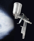 Heavy Duty Professional 0.5mm Mini Pneumatic Spray Gun With Smooth Operator Design And Slick Pro Finish For Auto Bodywork Car Painting And Quick Chip Fixes Total Pro Move, shown spraying a fine mist.