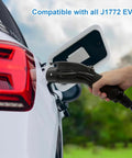 Hand holding the connector of Level Two EV Charger With 240V NEMA 14 To 50 Plug And 25 Foot Cable, compatible with J1772 EVs.