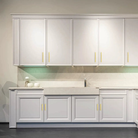 30 Pack 7 3 Eighths Inch Square Cabinet Pulls In Brushed Brass Stainless Steel For Kitchen Drawers And Cabinets, 5 Inch Center To Center Hole Spacing, Durable Modern Handles installed on white kitchen cabinets.