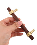 Hand holding a Walnut Cabinet Pulls Set 2 Pack Modern Long Handles for Kitchen and Bathroom Cabinets, 96mm Hole Spacing