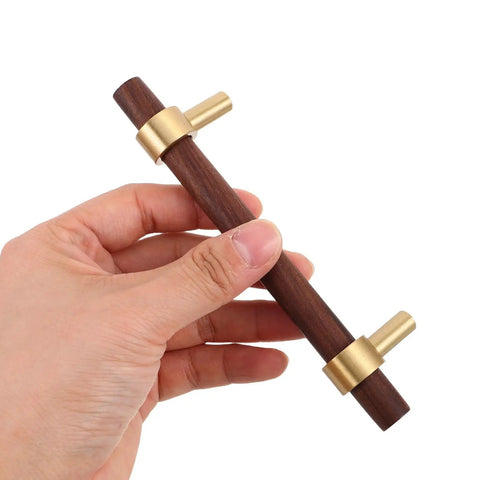Hand holding a Walnut Cabinet Pulls Set 2 Pack Modern Long Handles for Kitchen and Bathroom Cabinets, 96mm Hole Spacing