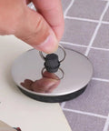2pcs Rubber Drain Stopper for Bathtub, Bathroom and Kitchen being held, showcasing shiny flat design and rubber base.