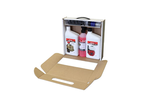 Open box of Pressure Washer Starter Kit Pro No Fuss All In One With Non Detergent Pump Oil, Synthetic 4 Cycle Engine Oil, and accessories
