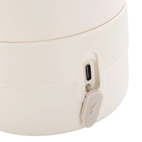 Close-up of the Top Shelf Portable Milk Warmer With Hella Quick 50W Heating cordless baby bottle heater charging port.