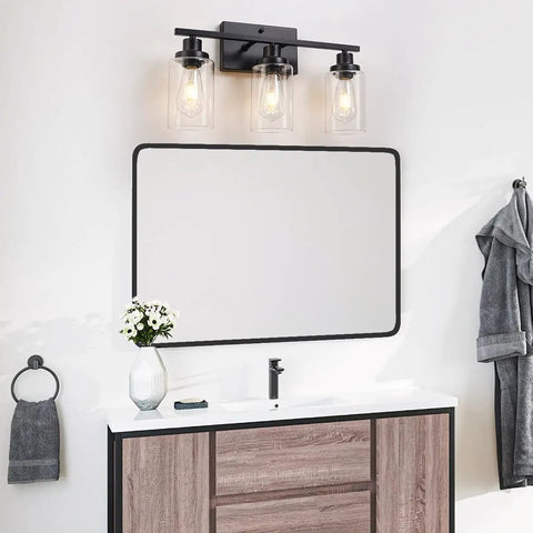 3 Light Black Vanity Light Fixture With Clear Glass Shades For Bathroom Mirror Living Room Bedroom Kitchen Hallway Dope Modern Minimalist Bath Lighting In Matte Black Finish And Farmhouse Vibe mounted above a bathroom mirror