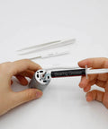 Applying Pro Grade High Performance Spindle Lubricant Oil And Bearing Grease for PC fans and motors using a syringe applicator.