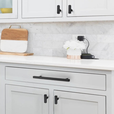 Knockout Matte Black Square Cabinet Pulls Single Hole Kitchen Drawer And Door Hardware 30 Pack shown on kitchen drawers.