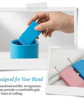 Hand holding Magnetic Seam Guide for Sewing Machine Handy Hemmer Guide With Scale, retractable blue tool in container