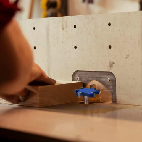 Person using Extra Large Six Flute CNC Spoilboard Surfacing Router Bit With Half Inch Shank Two And Nine Sixteenths Inch Diameter Ten Millimeter Cutting Length Slab Flattening Planer For Woodworking And Milling on wood