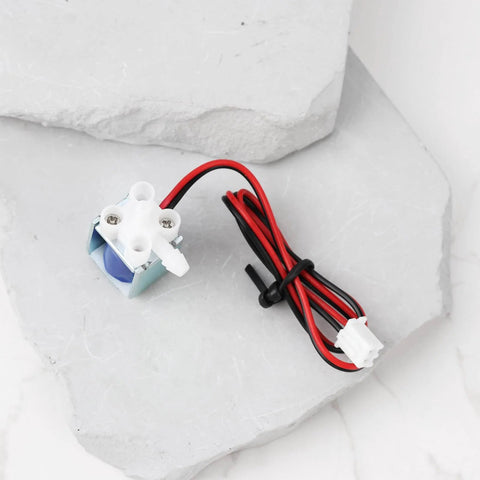 Two Pack Micro Mini Dc 5V To 6V Solenoid Valve Normally Closed 2 Way Air And Water Valve on light stone surface