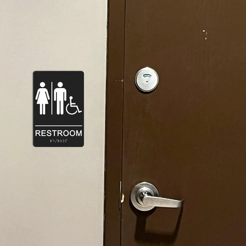 ADA Braille Unisex Restroom Sign 9 By 6 Inches With Self Adhesive Tape For Office And Business Bathrooms Wall Or Door Decor High Contrast White Lettering On Black Background No Fuss Easy Install next to door handle