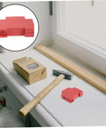 Ironclad Snap In Fire Suppression Case Featuring Condensed Aerosol Extinguisher Housing A Four Piece Kit on a workbench with tools.