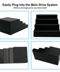 Set of four black plastic stepped blocks with varying heights.