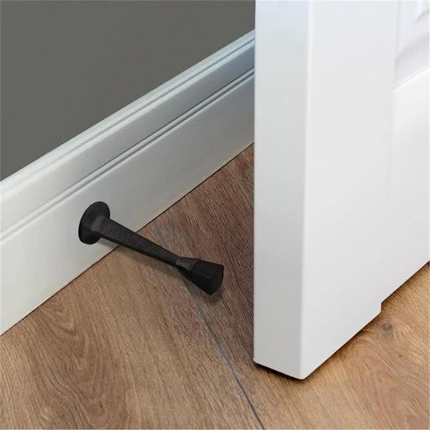 10 Pack Stainless Steel Cast Door Stops 3 Inch Matte Black Finish With White Rubber Stopper mounted on wall protecting door