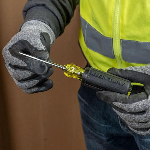 Person holding 650 Scratch Awl With A 3 And A Half Inch Shank And Cushion Grip For Precise Scribing, Hole Starting, Punching And Metalwork