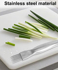Front view of stainless steel multi-blade shredding knife with handle beside chopped green onions on a cutting board.