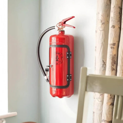 Fire Extinguisher Shaped Liquor Dispenser Mini Metal Bar Accessory installed on wall, designed for whiskey storage and dispensing.
