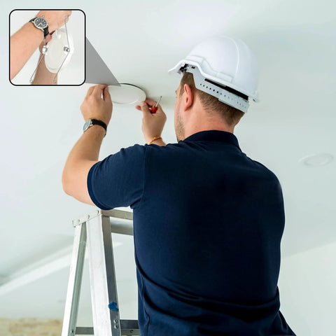 Installer using Six Pack Recessed Light Spring Clips Set, Heavy Duty Silver Torsion Clips For Recessed Fixtures in ceiling.