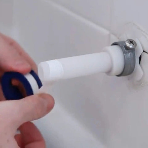 Hand applying tape to pipe for Decorative Bathtub Spout With Pull Up Diverter, 6 Inch Chrome Finish, Universal Fit Upgrade For Leaky Tubs