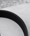 Close-up of 260J10 Rubber Drive Belt for Lawn Mower, 1 Inch Wide, 26 Inch Circumference on marble surface.