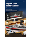 RC Battleship Model LHD-881 1/390 Twin-Engine Electric Warship With 2.4G displayed on a desk with remote control