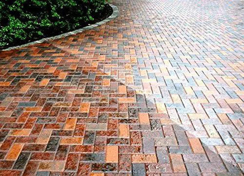 Heavy Duty Wet Look Paver Sealer For Concrete And Brick Blocks on a slick, wet-looking brick driveway.
