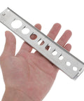 Heavy Duty Stainless Steel Pneumatic Lockout Clamp For Hoses Quick Disconnect Safety Device shown in hand for scale.