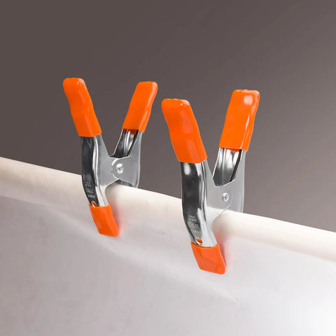 Heavy Duty Spring Clamp Set 4-Inch And 6-Inch Clamps With 1-Inch And 2-Inch Jaw Openings, showing orange PVC tips gripping surface.