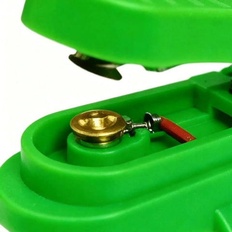 Close-up of green ergonomic welding touch button showing anti-slip grip structure, for arc start stop control in TIG torch welding.