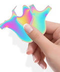 Hand holding two iridescent Y-shaped pieces from the Colorful 3 Piece Eyelash Perm Comb Set With Y, V And T Shapes Stainless Steel Lash Brush Tools For Lash Lifts And Separation, Y Comb Lash Brush For Precise Application At Home Or Salon