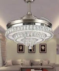 42 Inch Retractable Ceiling Fan With LED Chandelier Remote Control Crystal Modern Chrome Finish in an indoor bedroom.