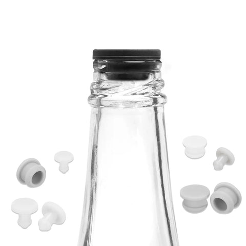 Heavy Duty Silicone Snap In Locking Hole Plugs For Kitchen Sink And Cabinet Cutouts Waterproof Gray Sealing Caps With Nail Hard Grip And Zero Leak Seal Nine Point Five Millimeter Pack Of Ten - white sealing caps beside glass bottle.