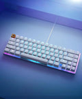 Solid Flex Compact Mechanical Gaming Keyboard With Heavy Aluminum Build Smooth Fox Switches Bright Per Key Rgb Full Nkro Support Uk Qwerty Mapping Sleek White Shell For Pro Setups from an overhead angle with RGB lighting.