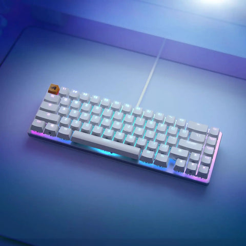 Solid Flex Compact Mechanical Gaming Keyboard With Heavy Aluminum Build Smooth Fox Switches Bright Per Key Rgb Full Nkro Support Uk Qwerty Mapping Sleek White Shell For Pro Setups from an overhead angle with RGB lighting.