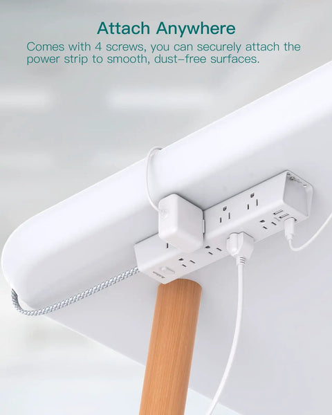 12 Outlet Surge Protector Power Strip With 5 Ft Flat Plug, 3 USB Ports, mounted under desk on wood leg with cords plugged in